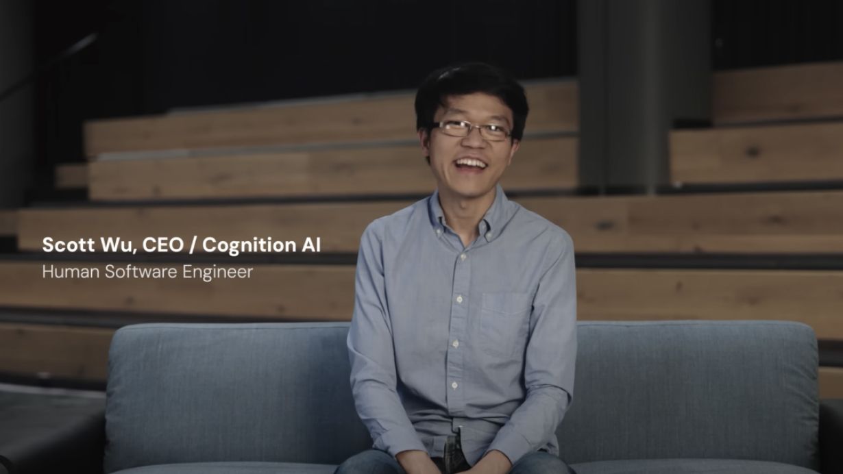 Cognition 的 Devin 发布视频画面，Scott Wu 坐在沙发上介绍产品，字幕标注其姓名与身份。